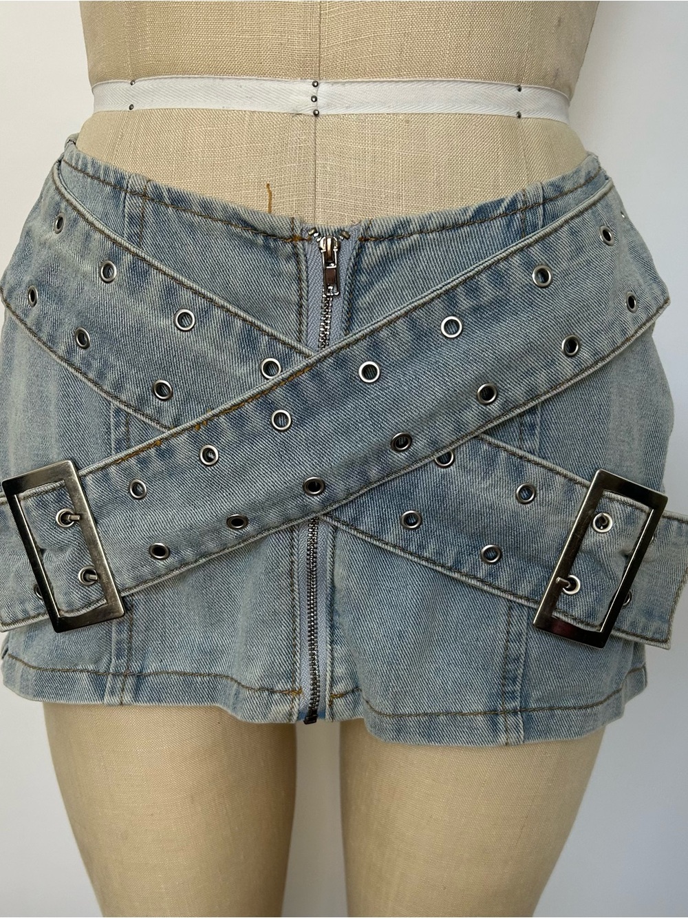 Grommet Detail Light Wash Denim Mini Skirt